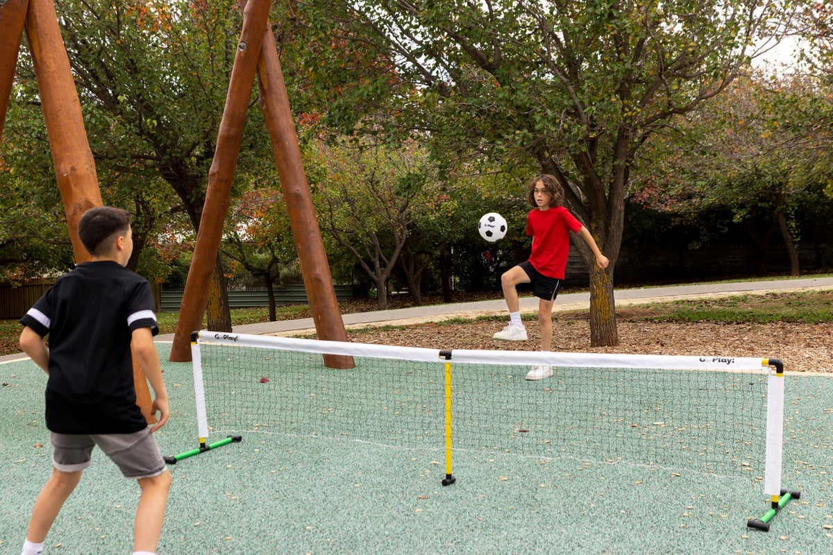 Go Play! Racquet / Soccer Tennis Set, 2 boys playing soccer tennis