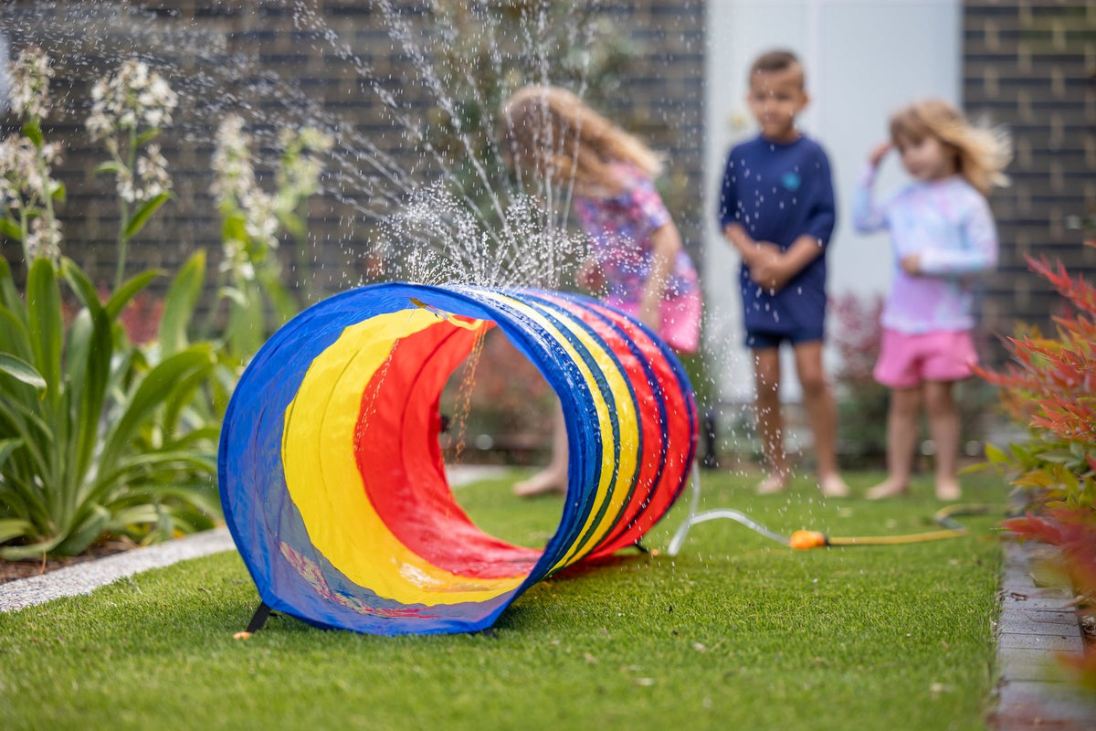 Go Play! Sprinkle & Splash Tunnel in action on lawn