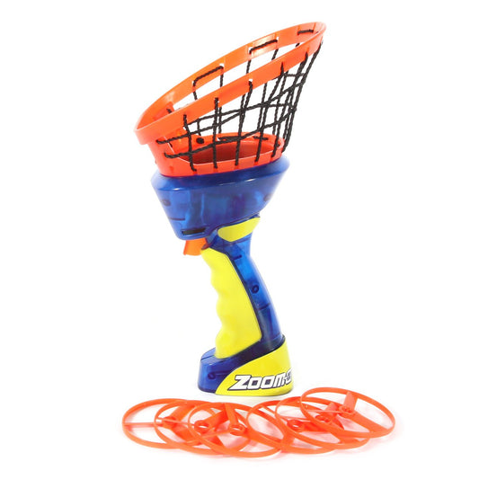 A toy basketball hoop toy with a blue and yellow handle, orange rim, black net, and orange throwing discs in front, on a white background.